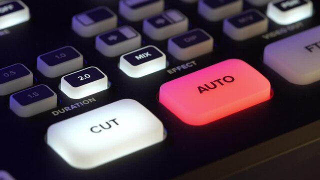 A close-up image of the video switcher; the Auto button activates automatic camera switching.