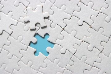 Jigsaw puzzle with missing piece. Missing puzzle pieces. Concept image of unfinished task. Completing final task, missing jigsaw puzzle pieces and business concept with a puzzle piece missing. blue - Powered by Adobe