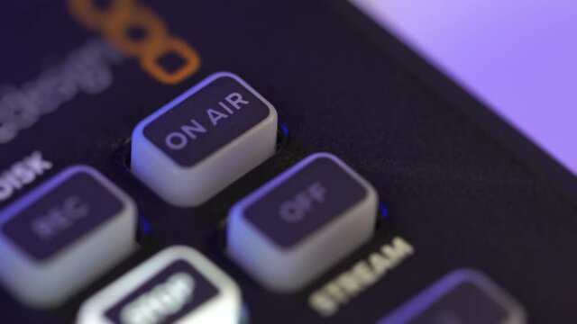 A close-up image of a video switching device with an on-air button for broadcasting the live stream.