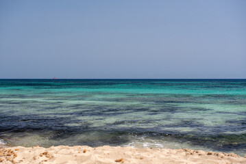 Fototapeta na wymiar Wonderful turquoise water of Migjorn beach in Formentera in Spain..
