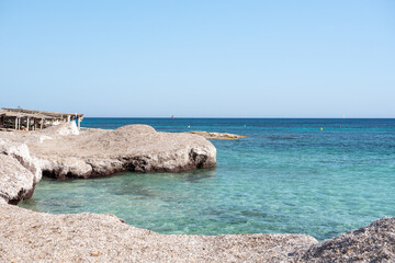 Wonderful turquoise water of Migjorn beach in Formentera in Spain..