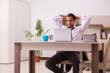 Young male employee working from home during pandemic