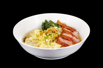 Egg Noodles with Grilled Red Pork and Pork Wontons isolated on black.Chinese cuisine