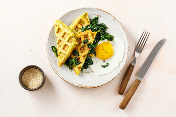 Warm waffles with spinach and cheese.