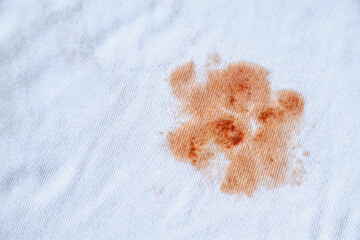 Dirty spicy sauce stain on kid shirt from eating in home