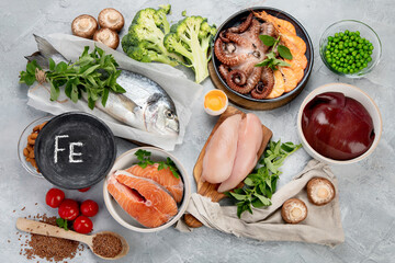 Food high in iron on light gray background. Healthy eating concept.