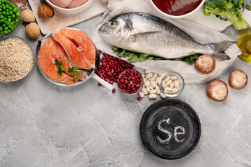 Food high in selenium on light gray background. Healthy eating concept.