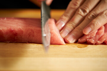 Cutting fresh tuna with a sashimi knife