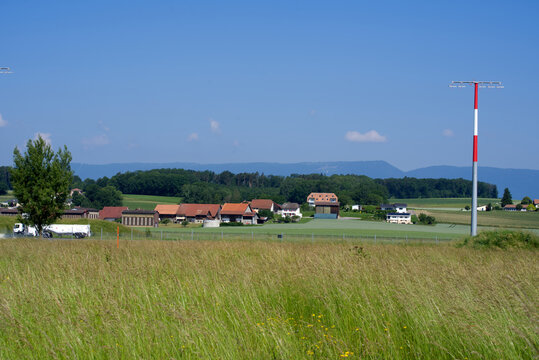 Landscape at the Swiss air force airbase at Payerne at summertime with fuel truck and airfield in the background. Photo taken June 11th, 2021, Payerne, Switzerland.