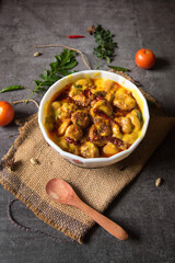 Karhi is a dish originating in Rajasthan, India. Made of  thick gravy based on gram flour, and contains vegetable fritters called pakoras. A north Indian delicacy. Top view.