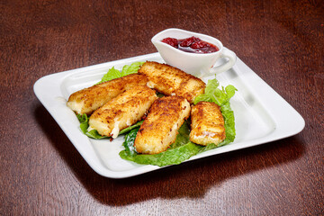 Fried cheese sticks with sauce