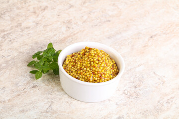 Grain mustard sauce in the bowl
