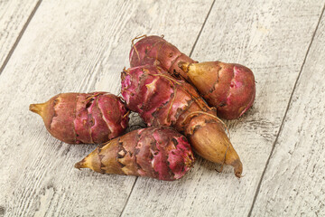Raw topinambur root or Jerusalem artichoke