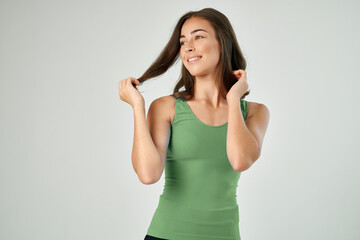 Fototapeta premium pretty brunette holding her hair fashion hairstyle care smile of the year