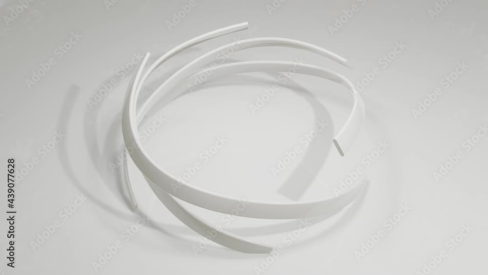 Poster abstract looped animated background. gray sticks twisted in a semicircle rotate on a gray background