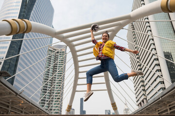 Smiling American engineer jump in city