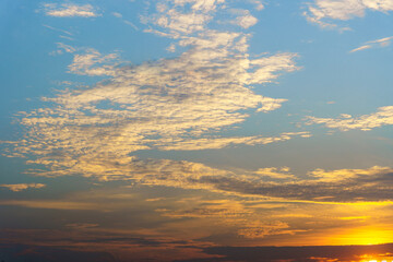 Sky and clouds in the evening with beautiful colors. The sky is blue and gold.