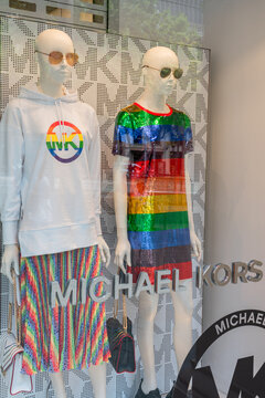 BARCELONA, SPAIN - JUNE 10, 2019: Michael Kors Store Ready For The Annual Gay Pride Parade. Rainbow Clothes Decorated Mannequins In Shop Window Display.