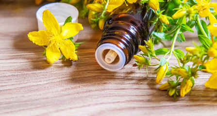 extract St. John's wort in a small jar. Selective focus.