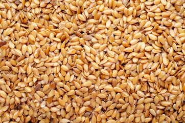Top view of dry golden flax seed background