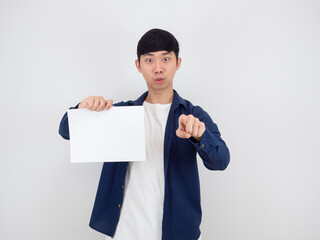Asian man handsome holding blank paper point at you on white background