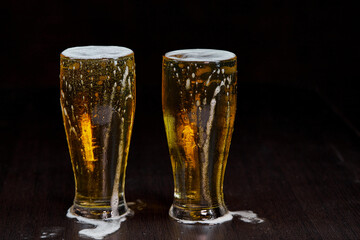 glass of beer on dark background