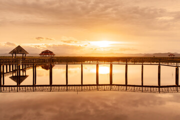 Dramatic sunset sky over the tropical lake.