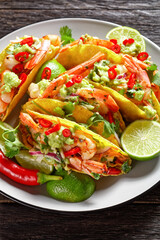 taco shells with shrimps on a plate