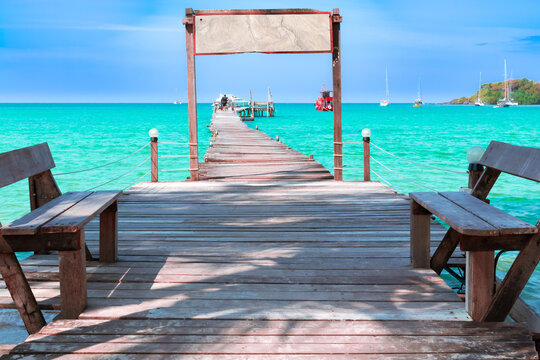 Landscape of seascape with wooden bridge in the sea at Koh Kood is a tropical island with emerald green water and beautiful beaches amidst clear blue sky.