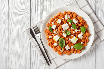 eggs scrambled with tomatoes and feta cheese