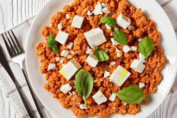 eggs scrambled with tomatoes and feta cheese