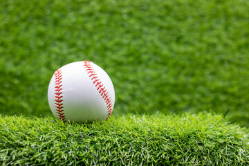 Baseball on green grass 