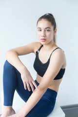 Natural beauty brunette model no make up in swimsuit posing in studio on isolated background. Model tests, natural no make up models concept