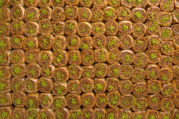 Turkish desert baklava with peanut, pistachio for holiday or ramadan. Traditional Middle Eastern Flavors. Selective focus, pattern.