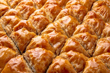 Turkish desert baklava with peanut, pistachio for holiday or ramadan. Traditional Middle Eastern Flavors. Selective focus, pattern.