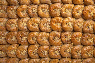 Turkish desert baklava with peanut, pistachio for holiday or ramadan. Traditional Middle Eastern Flavors. Selective focus, pattern.