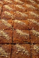 Turkish desert baklava with peanut, pistachio for holiday or ramadan. Traditional Middle Eastern Flavors. Selective focus, pattern.