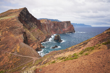 East Madeira coast landscape view with mountains, cliffs, rocks, hiking trails for tourists and sea. Atlantic ocean. Favorite touristic destination.