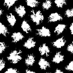 Vector seamless pattern with ink stains on black background. Illustration with grungy texture