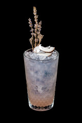 Lavender and coconut cocktail on a dark background. Isolated