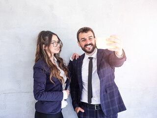 Two happy coworkers posing for a photo together