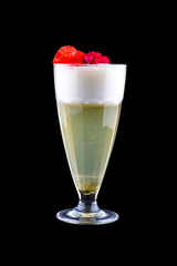 Pear cocktail, decorated with flowers on a dark background. Isolated