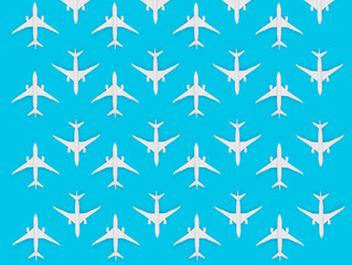 Creative summer concept with toy airplanes on pastel blue background. Flat lay design 