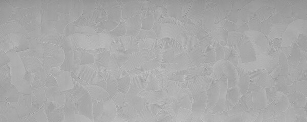 Naklejka premium The pattern on the wall. Gray background. Relief, waves.