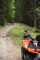 Fototapeta na wymiar ATV quad on forest road
