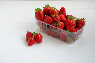 Ripe beautiful red strawberries on a white background.