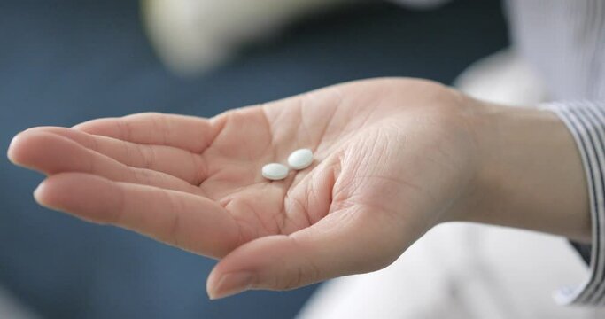 Hands of a woman with medicine