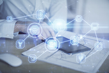 Double exposure of man's hands holding and using a phone and social network theme drawing.