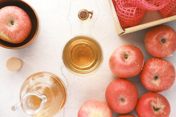 apple vinegar in glass bottle with fresh red apple on table 