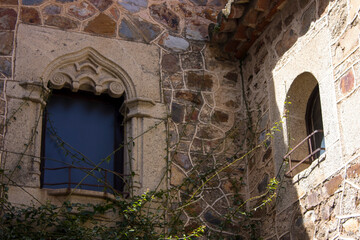 Caceres, Spain. Stone windows in the Old Monumental Town, a World Heritage Site